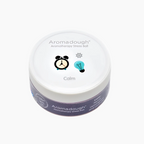 Aromadough aromatherapy stress ball with a white lid and purple body on a white background